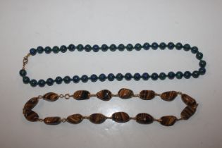 A tigers eye stone necklace and a malachite Azurit