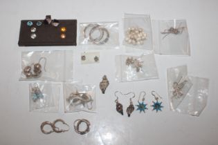 Twenty pairs of sterling silver ear-rings