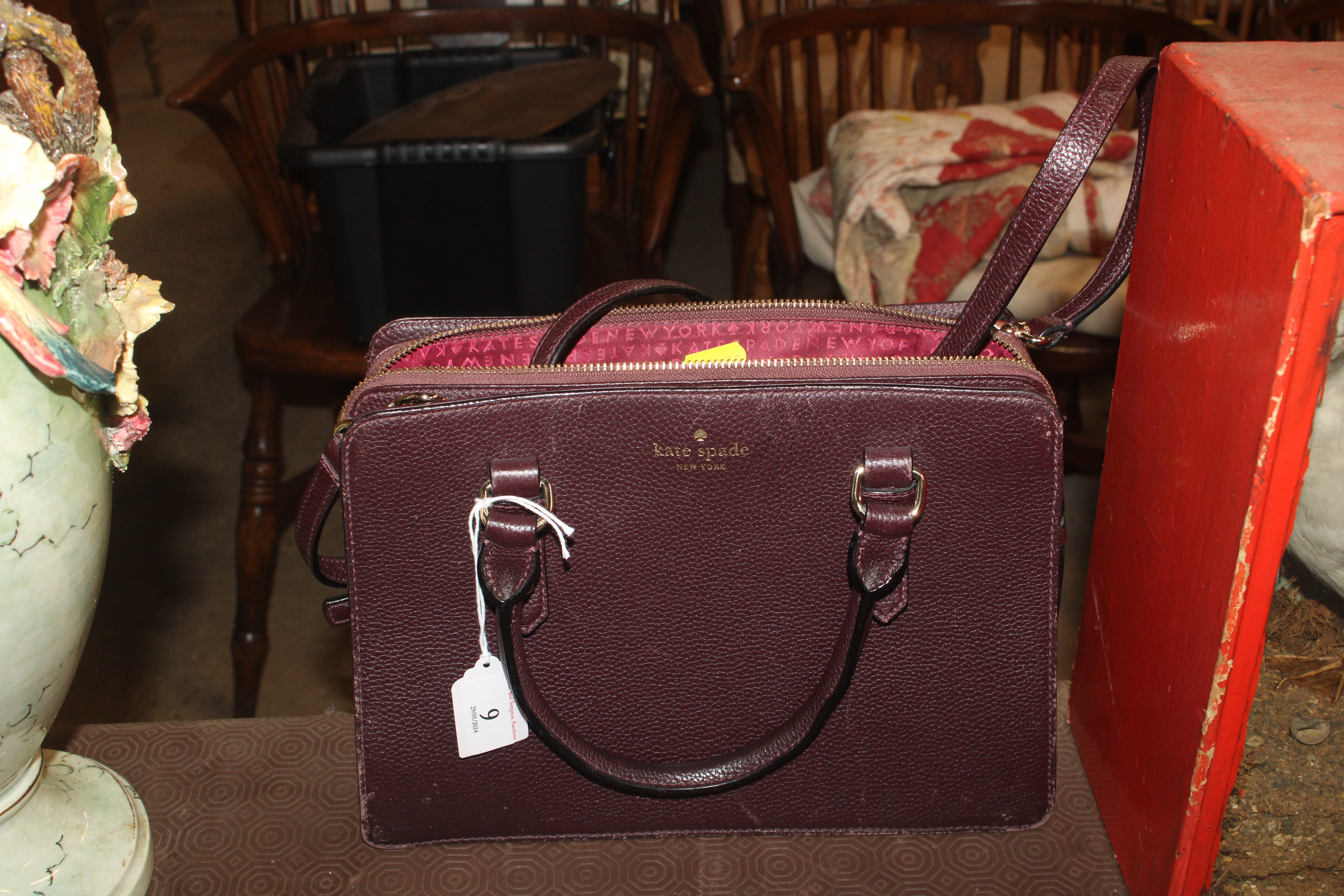 A Kate Spade burgundy handbag