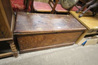 An elm coffer with candle box interior