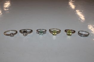 Six sterling silver and white metal rings includin