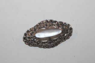 A vintage sterling silver and marquisette brooch,