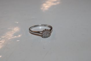 A 9ct white gold diamond cluster ring, approx