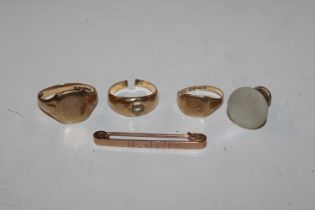 An 18ct gold ring, approx. 105gms; two 9ct gold ri