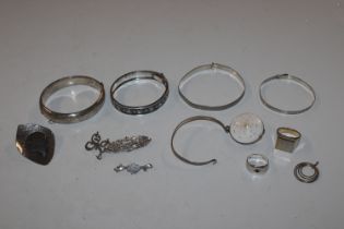 A sterling silver brooch; bangles; white metal jew