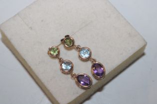 A pair of 9ct gold amethyst, peridot and blue topa