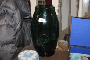 A Whitefriars style green glass vase