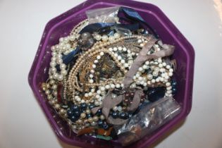 A box of various costume jewellery and wrist watch