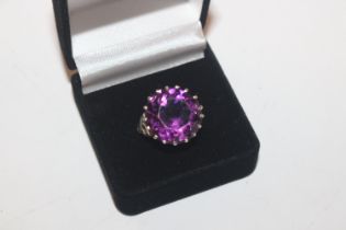 A 925 silver and amethyst coloured stone ring