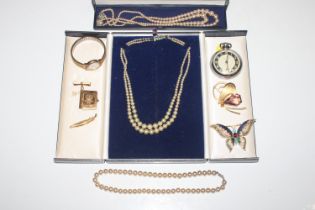 A box of various costume jewellery including neckl