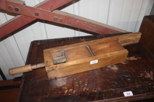 A vintage wooden clamp