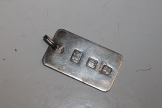 A silver ingot pendant, hallmark London 1976