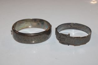 Two silver snap bangles, approx. total weight 61gm