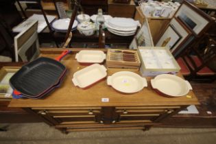 A quantity of various Le Creuset kitchenalia, Glosswood knives and forks