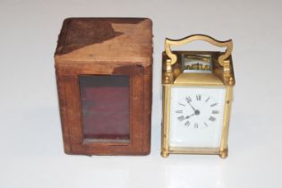 A brass case carriage clock and travelling case