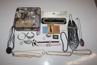 A box of various costume jewellery to include watc