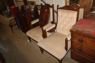 A pair of Edwardian upholstered armchairs