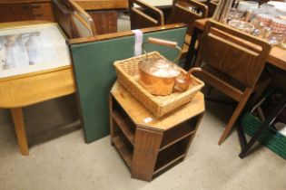 An oak side table with integral shelves, a wicker