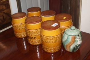 A set of six Shannon Pottery storage jars and one