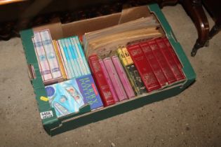 A box of children's books including Harry Potter, lion comics and villain comics