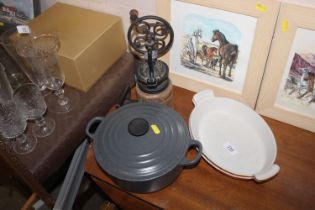 A Le Creuset casserole dish together with two Le Creuset style cooking dishes etc.