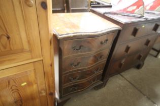 A mahogany serpentine fronted chest fitted four dr