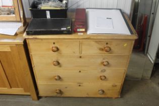 A stripped pine chest fitted two short over three