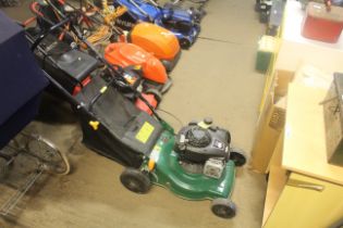 A petrol rotary garden lawn mower with Briggs and