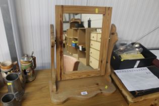 A pine swing framed mirror