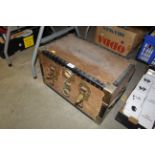 A metal bound wooden traveling trunk of small prop