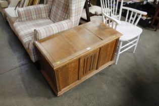 An oak linen fold decorated blanket box