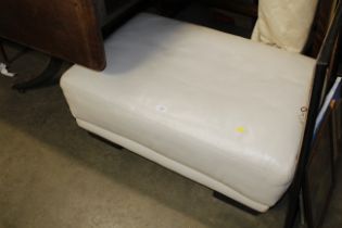 An upholstered footstool