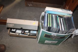 A box of CD's and cassette tapes