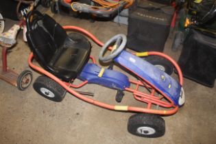 A child's Kettler pedal go-kart