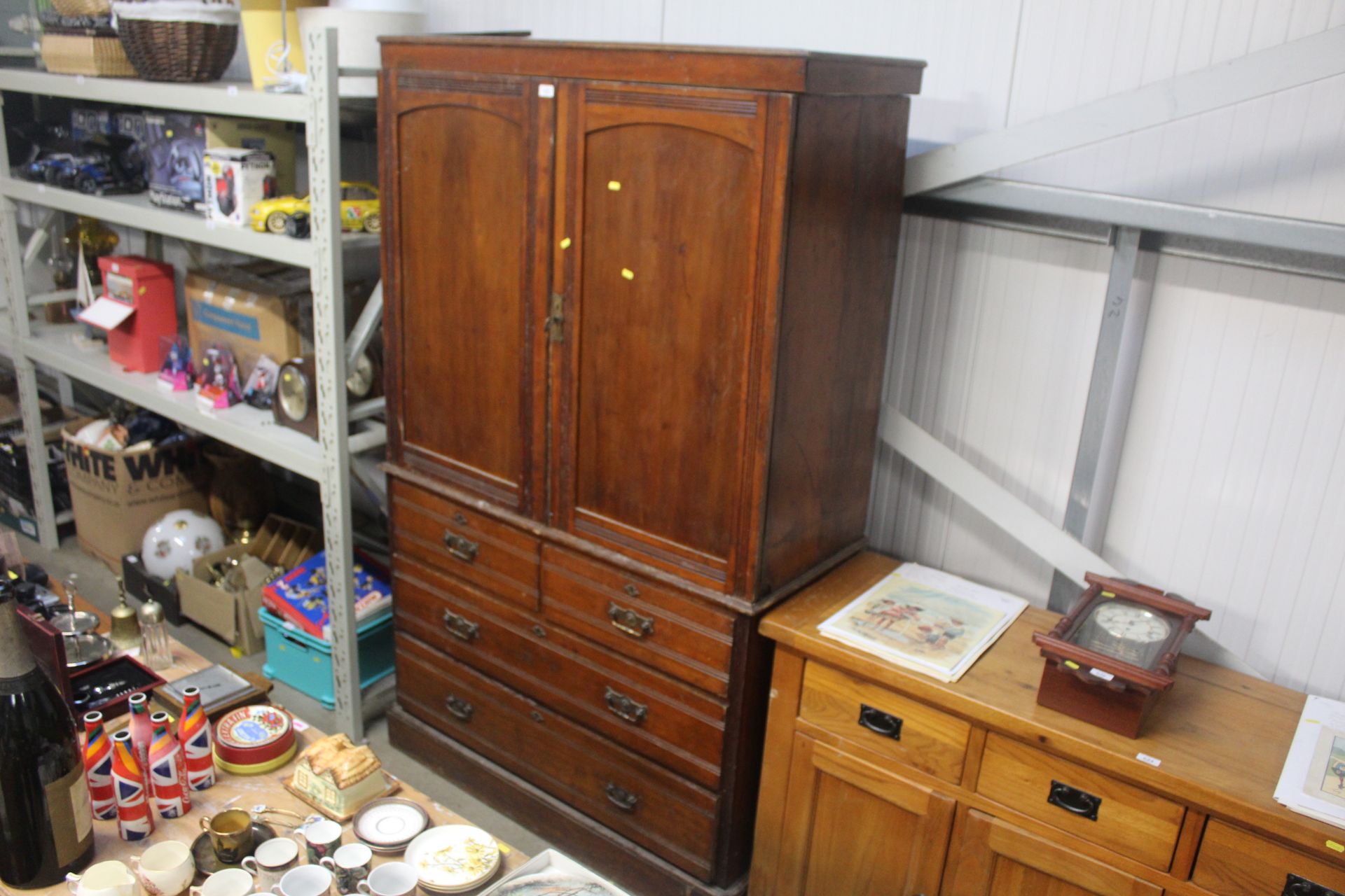 A late Victorian mahogany press cupboard fitted tw