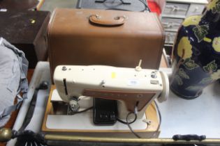 A Singer electric sewing machine sold as a collect