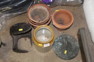 A quantity of terracotta plant pots, a cast iron s