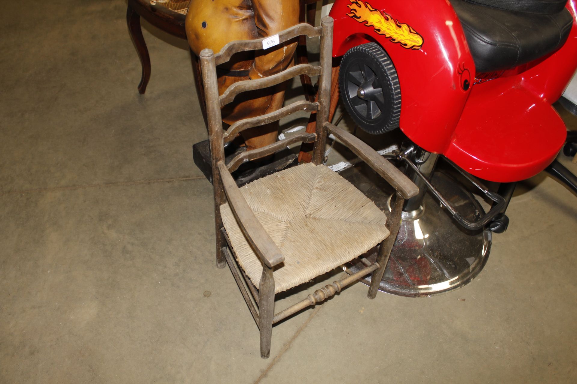 A rush seated child's ladder back chair AF