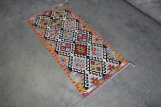 An approx. 5'3" x 2'4" Chobi Kelim rug