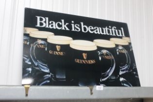 A reproduction Guinness advertising sign (207)