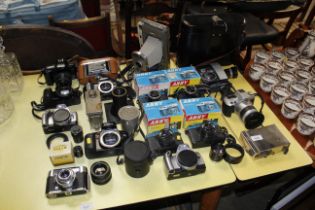 A Kershaw folding camera; Polaroid camera; various