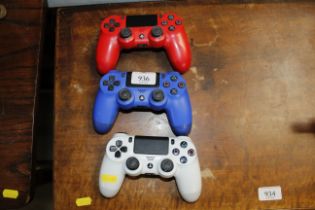 Three PlayStation four controllers