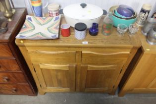 A modern light oak sideboard