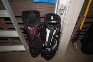 A Taylor Made golf bag and a Wilson golf bag