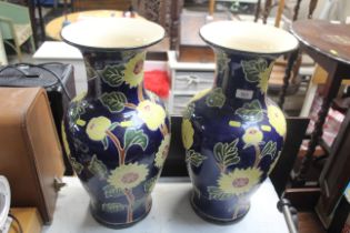 A large pair of baluster vases