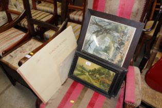 A collection of framed prints and a folder of prin