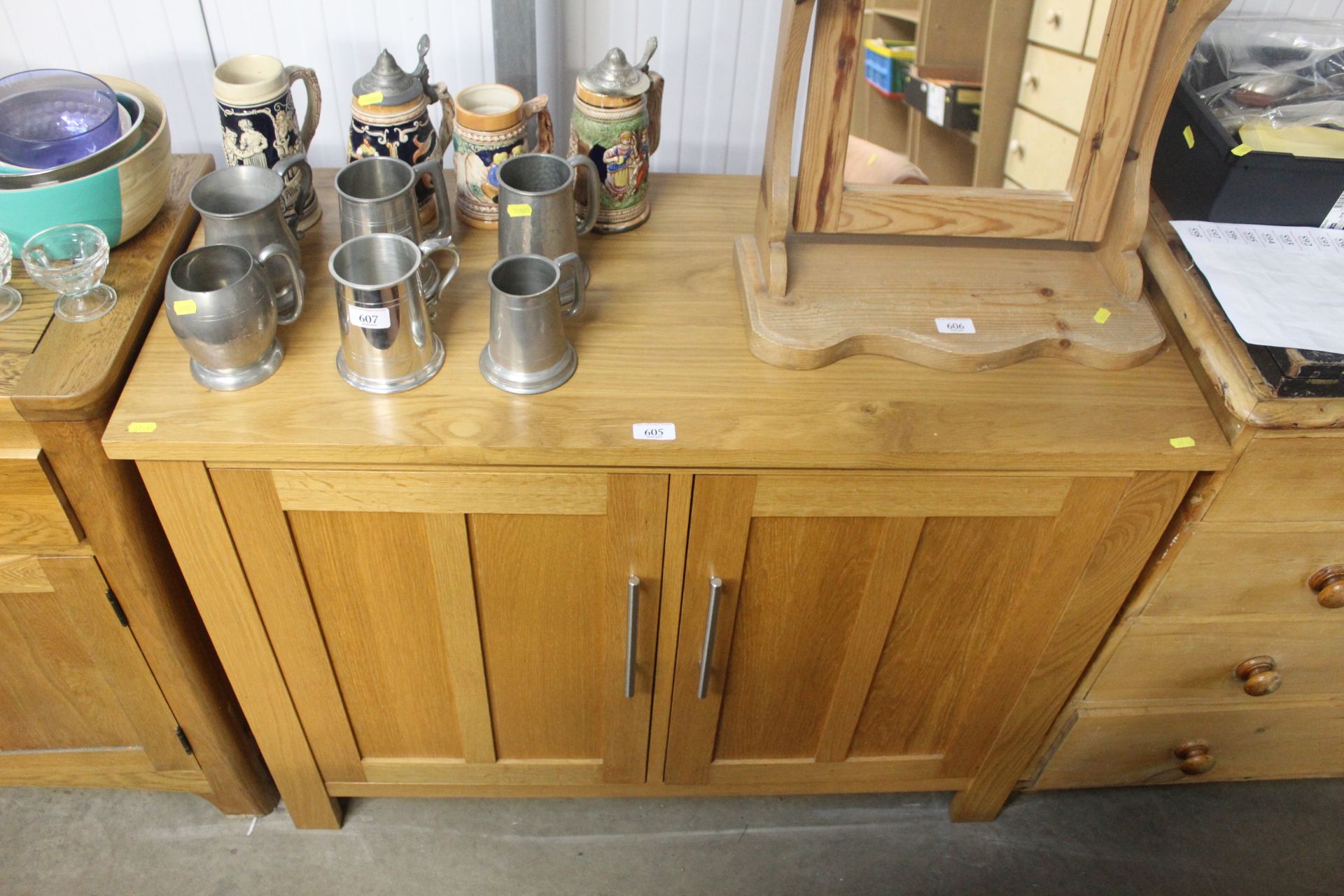 A modern light oak two door sideboard