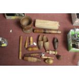 A box of various carved wooden items