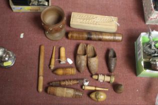 A box of various carved wooden items