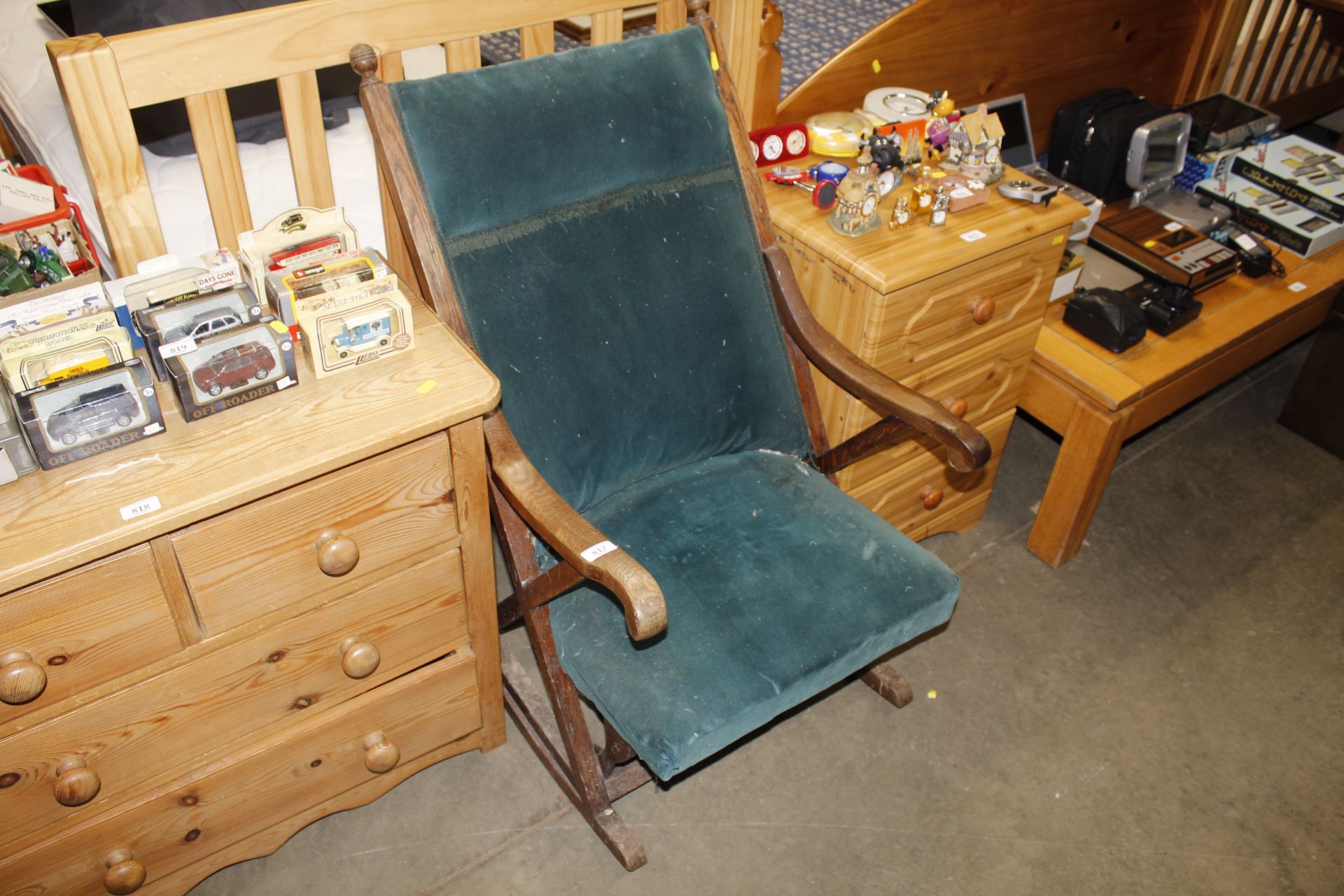 An oak framed and upholsters rocking chair